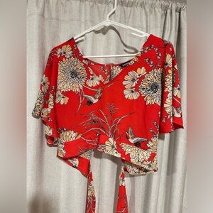 Express flowy orange top with open back and tie